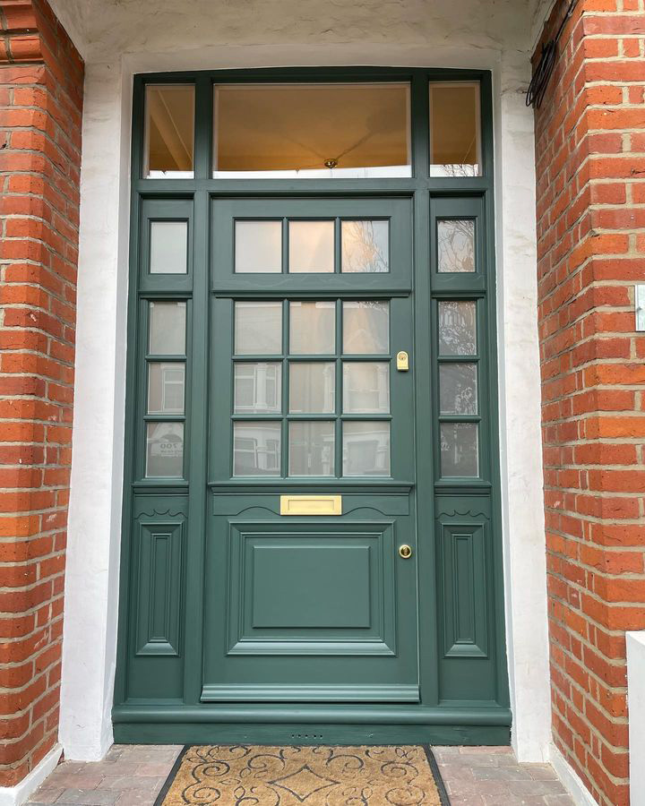 Newly installed modern, green wooden door