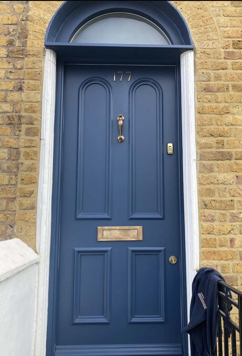 New blue front door with gold accents